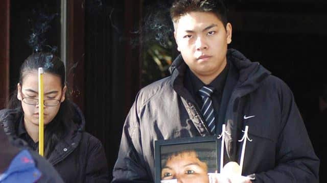Jennifer Pan and her brother at Bich's funeral.