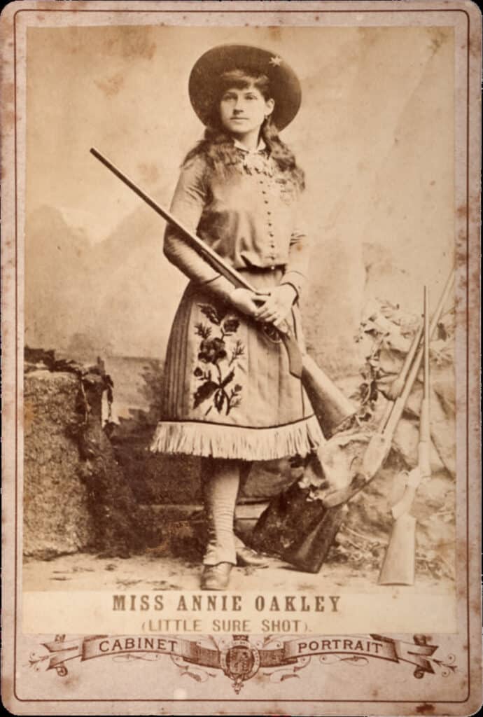 Cards like this were handed out to promote the traveling show. This one features Annie Oakley in her full costume. 