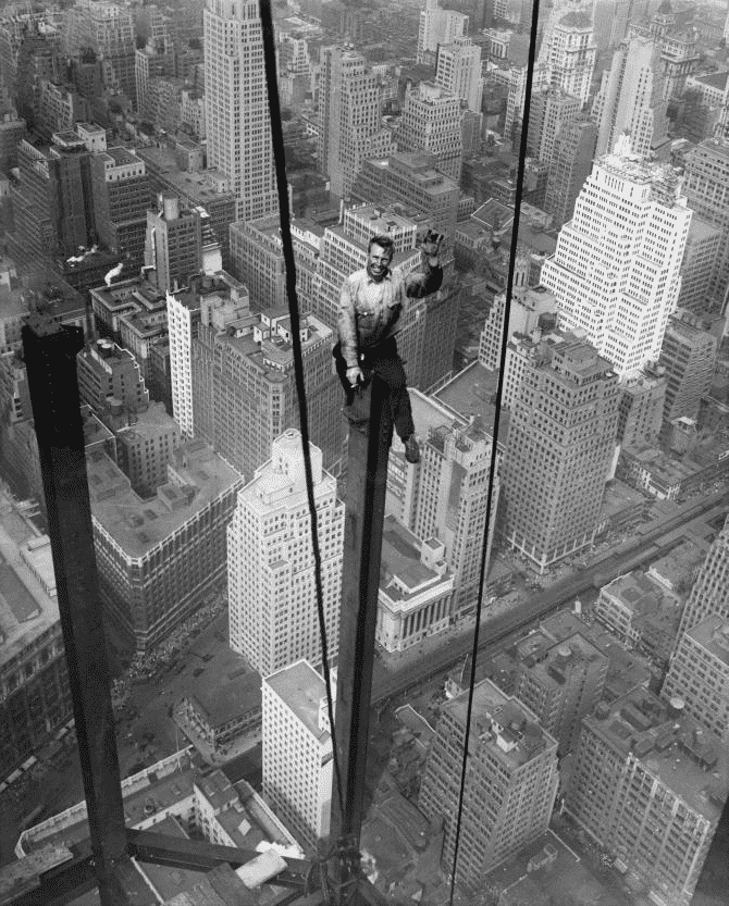 sitting in a a steel beam while building the Empire State building